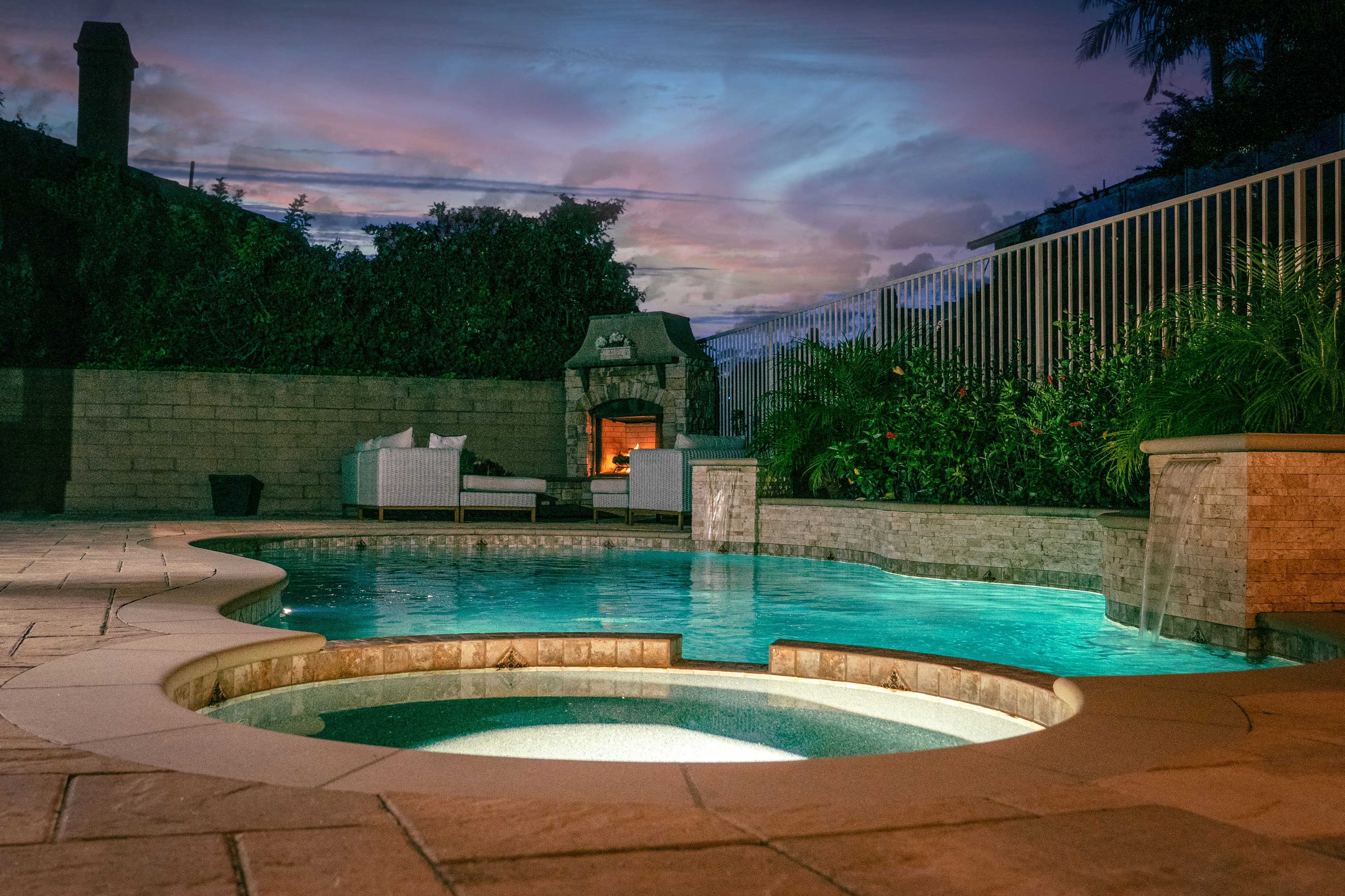 A completed outdoor renovation with elegant hardscaping and upgraded exterior details.